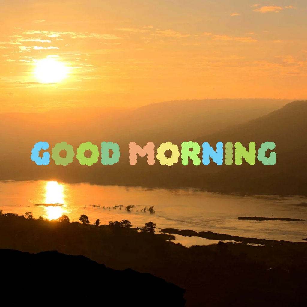 Good morning text on a sunrise view over river and mountains